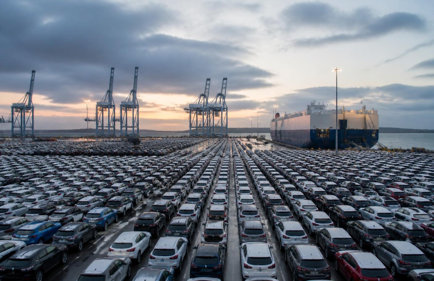 Vehicles at a UK port terminal awaiting shipping